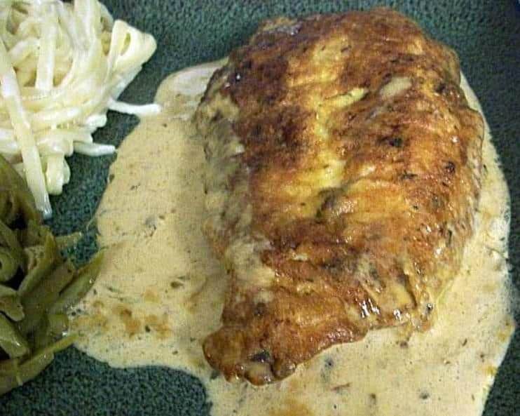  A mouth-watering look at the perfect caramelization on the chicken, enhanced by the lemon sage sauce