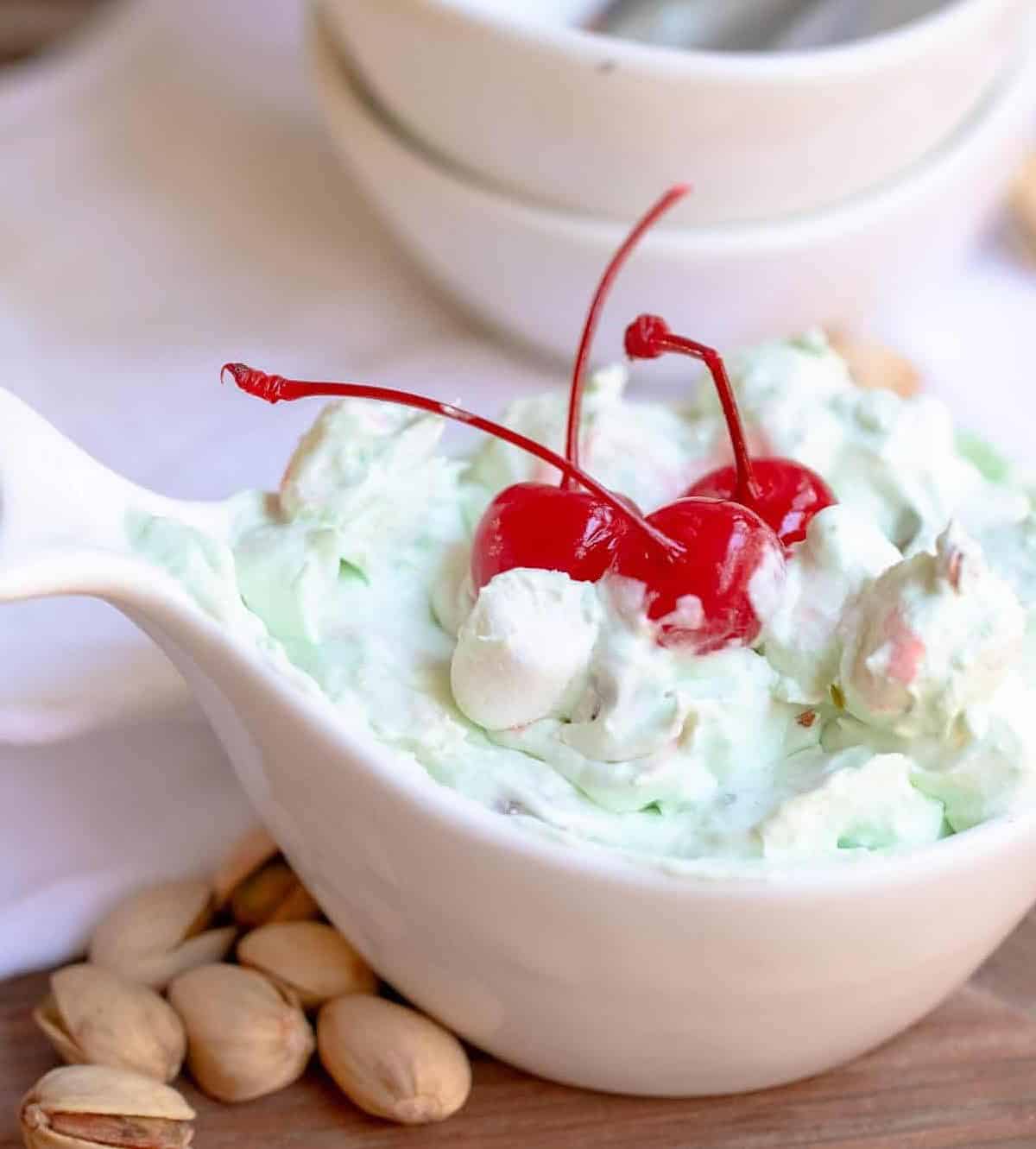  A spoonful of snowball salad with chunks of ripe bananas and nuts