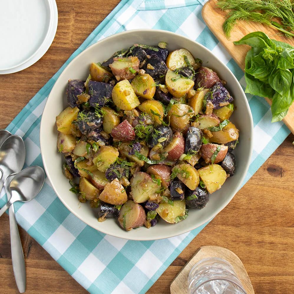  Add a pop of color to your plate with this festive potato salad.