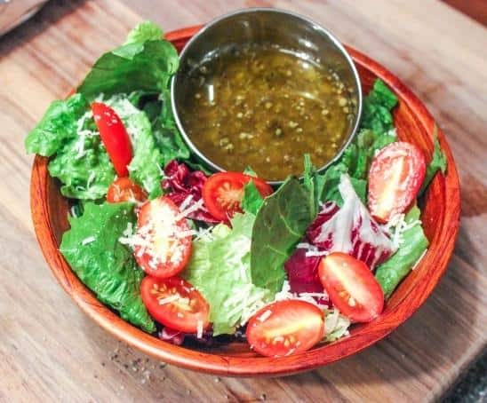  Add a pop of herbaceous flavor to your greens with this zesty oregano dressing