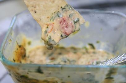  Adding a touch of Mexican flare to your next gathering with this cheesy dip.