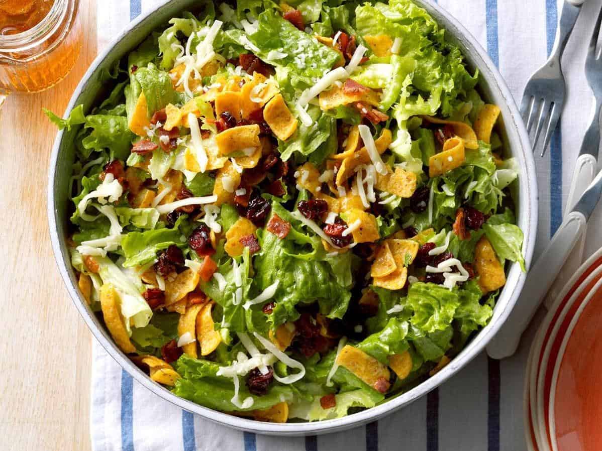 Dive into a sea of crisp greens and veggies with each forkful