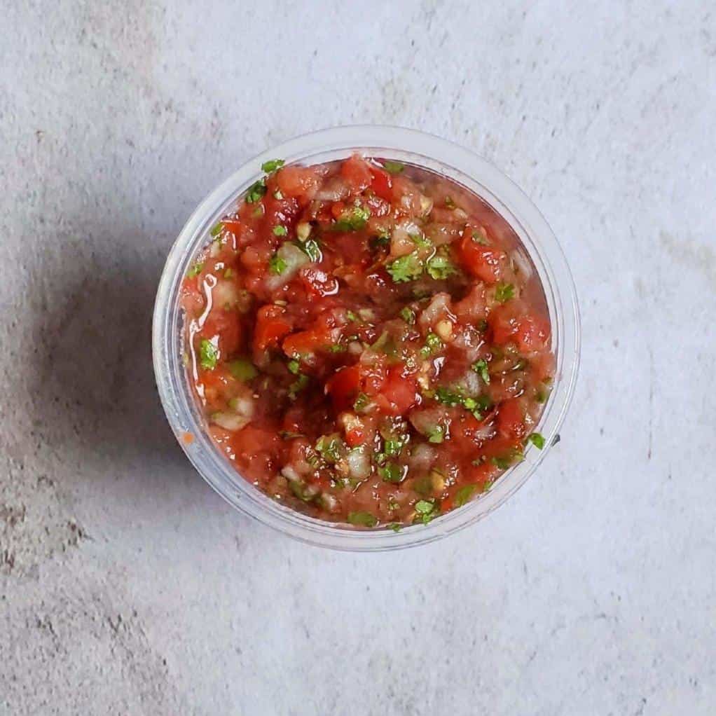  Don't just eat your tacos, dance with them through this tangy tomato salsa!