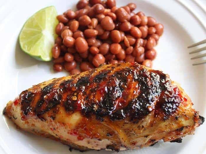  Elevate your backyard BBQ game with Cherry Bomb Chicken.