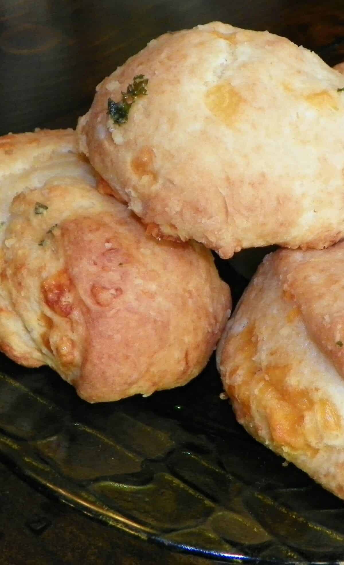  Flaky layers of biscuit dough flecked with savory herbs and bursting with gooey cheddar cheese.