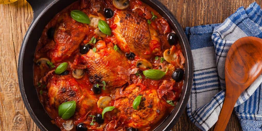  Juicy chicken thighs smothered in a savory tomato sauce.