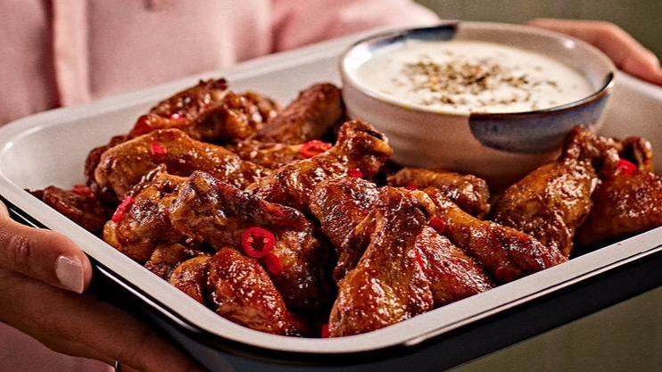  Make sure to have plenty of napkins on hand, these wings are messy in the best way possible!
