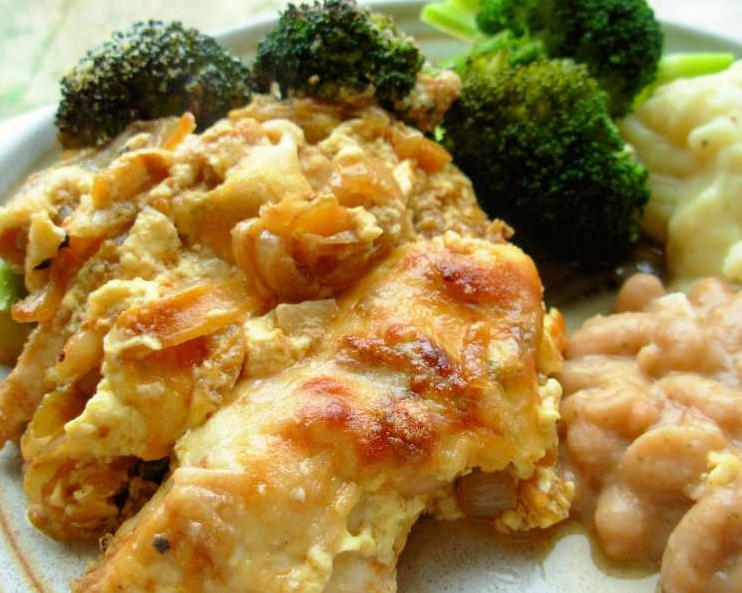  Perfectly golden brown chicken that's been baked in a rich and creamy sauce.