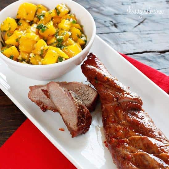  Perfectly seared pork medallions on a bed of sweet slices of mango.
