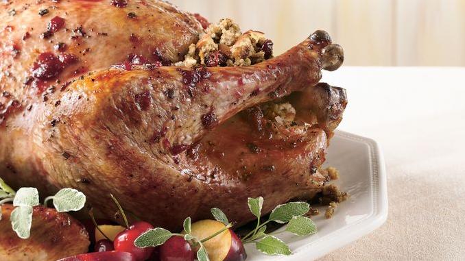  The apple stuffing adds a sweet and tangy flavor to balance the richness of the meat.