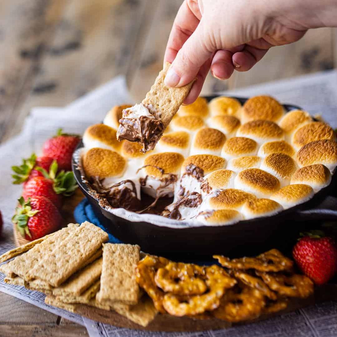  Toasty marshmallows meet melted chocolate in this ooey gooey S'mores Dip!